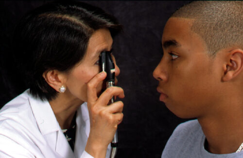 Optometrist doing low vision assessment